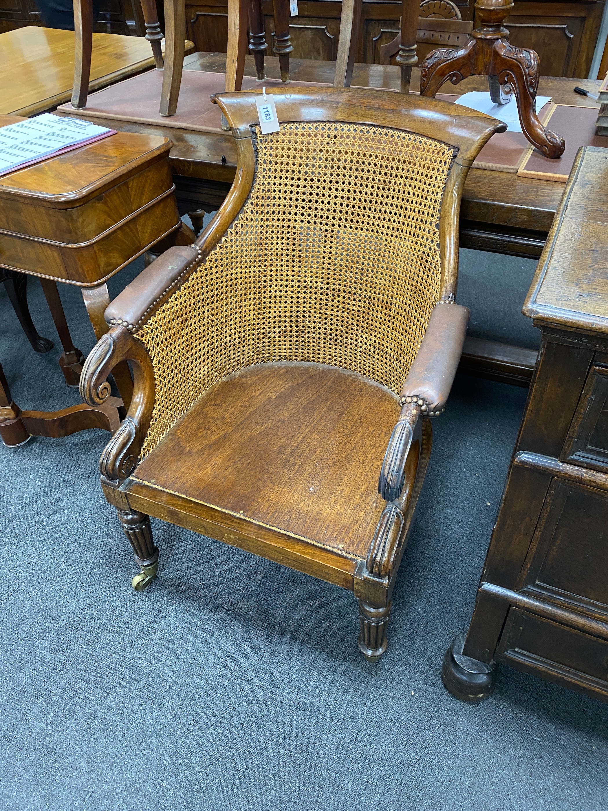 A Regency rosewood bergere armchair with later wood seat, width 62cm, depth 51cm, height 91cm